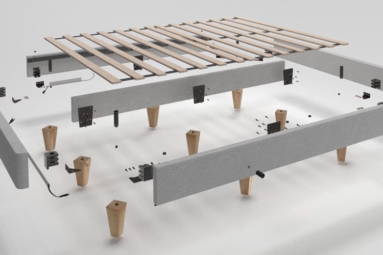  An exploded model of a platform bedframe with gray upholstery that shows corner brackets, screws, legs, and other details.